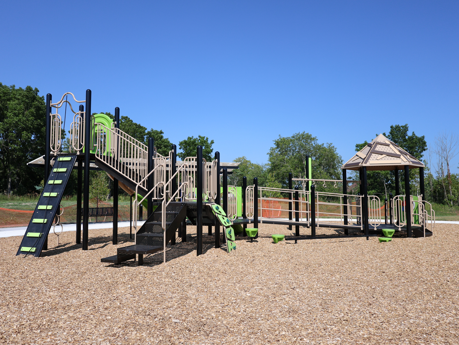 The play structure at Rose Park from a distance.